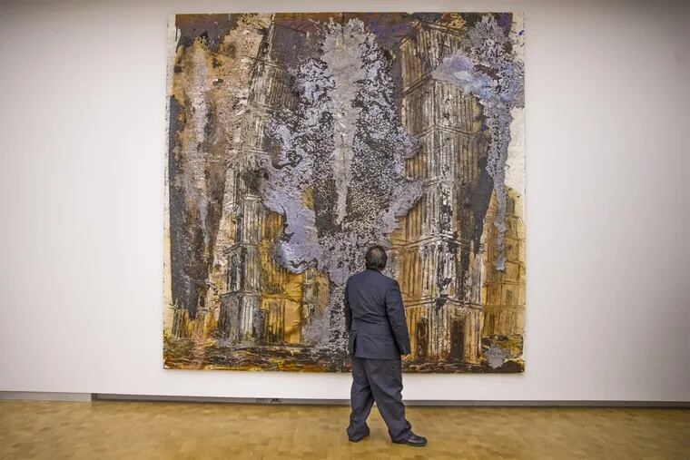 Anselm Kiefer’s “August Rodin: les Cathedrales de France (2016, oil, acrylic, shellac and lead on canvas) gets a close inspection at the press opening Thursday for the ‘Kiefer Rodin’ exhibition at the Barnes Foundation