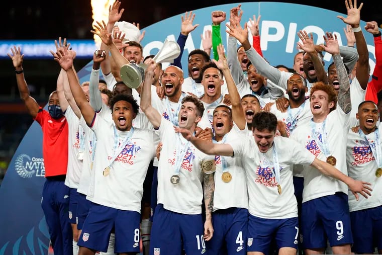 Hershey's Christian Pulisic lifts the trophy after captaining the U.S. men's soccer team to victory in the Concacaf Nations League final.
