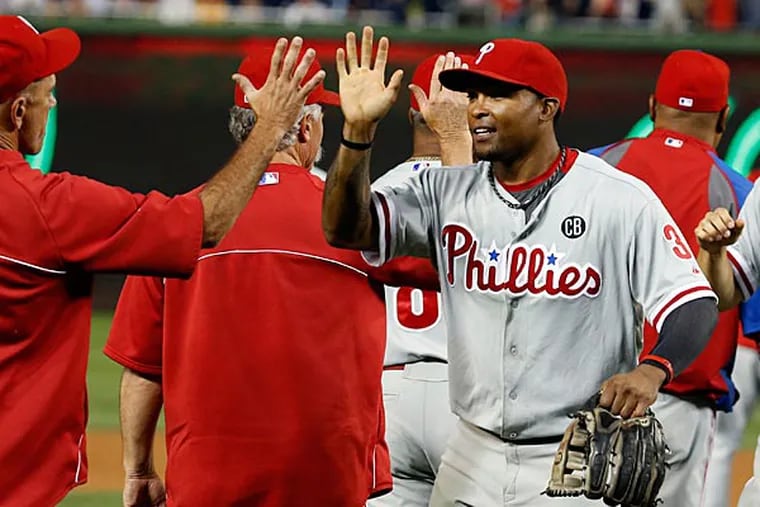 Phillies right fielder Marlon Byrd (3) celebrates after a baseball game at Nationals Park, Friday, Aug. 1, 2014, in Washington. Byrd hit a solo home run to win the game. The Phillies won 2-1. (Alex Brandon/AP)