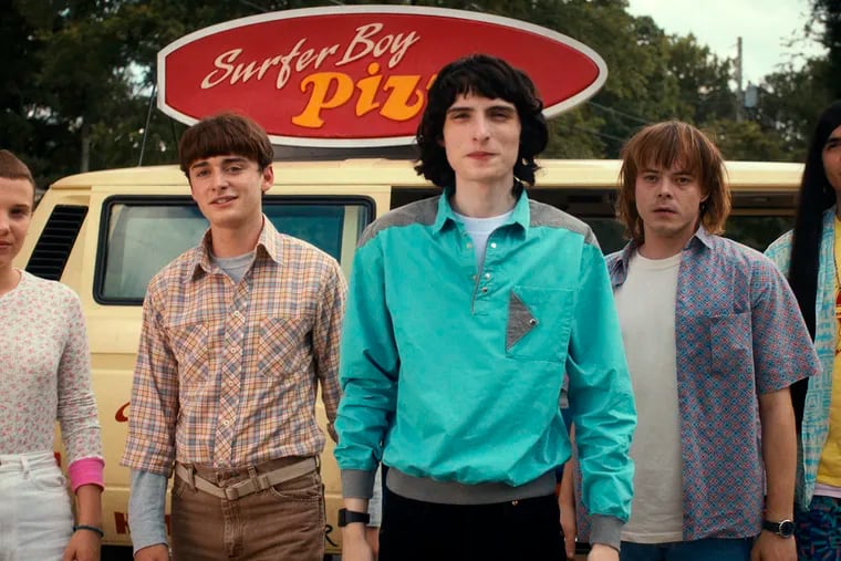 This image released by Netflix shows, from left, Millie Bobby Brown as Eleven, Noah Schnapp as Will Byers, Finn Wolfhard as Mike Wheeler, Charlie Heaton as Jonathan Byers, and Eduardo Franco as Argyle in "Stranger Things."