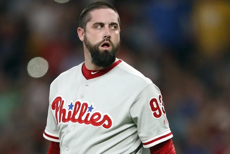 Phillies relief pitcher Pat Neshek walks back to the mound during his tumultuous seventh inning against the Braves on Friday.