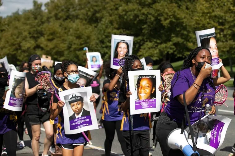Kai Coleman, 16, leads the young players of Eyekonz Field Hockey and Lacrosse in a "Walk for Justice" march in Philadelphia on Saturday, remembering victims of police brutality and calling for law enforcement reforms.