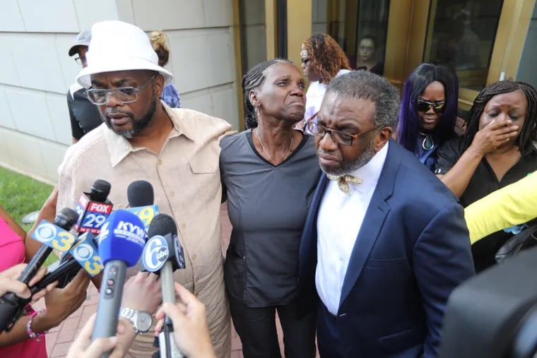 Rodney and Michelle Roberson speak outside the Chester County courthouse on Wednesday after hearing their daughter Bianca's killer plead guilty in her murder. They were joined by their family pastor, Wayne Croft (right), one of many supporters from the community who attended the hearing.