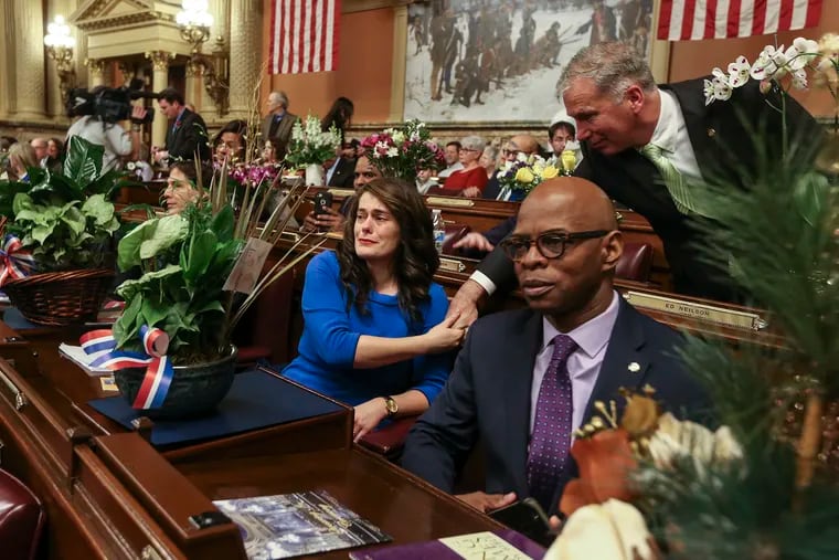Shaking the hand of state Rep. Ed Neilson (D. Philadelphia), Rep. Elizabeth Fiedler, also a Philadelphia Democrat, starts to tear up after taking the oath as a new member of the Pennsylvania House of Representatives in Harrisburg, Tuesday,  January 1, 2019. Rep. Stephen Kinsey (D., Philadelphia) is at right.   STEVEN M. FALK / Staff Photographer
