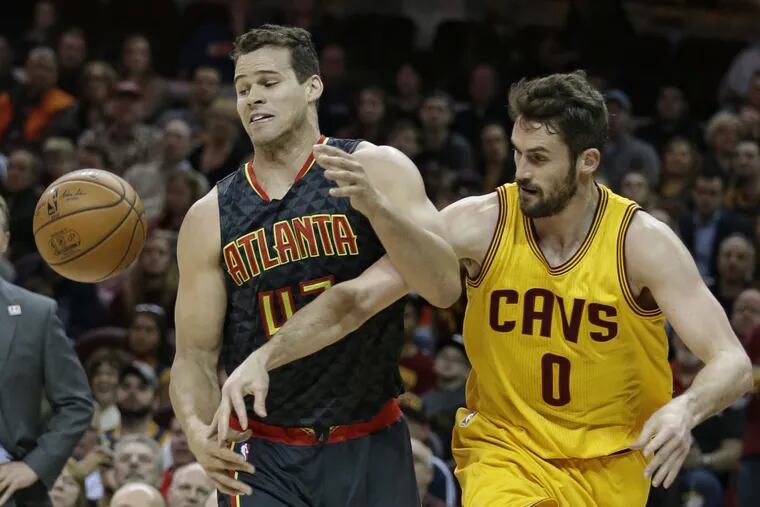 The Atlanta Hawks' Kris Humphries (43) and Cleveland Cavaliers' Kevin Love battle for the ball in April.