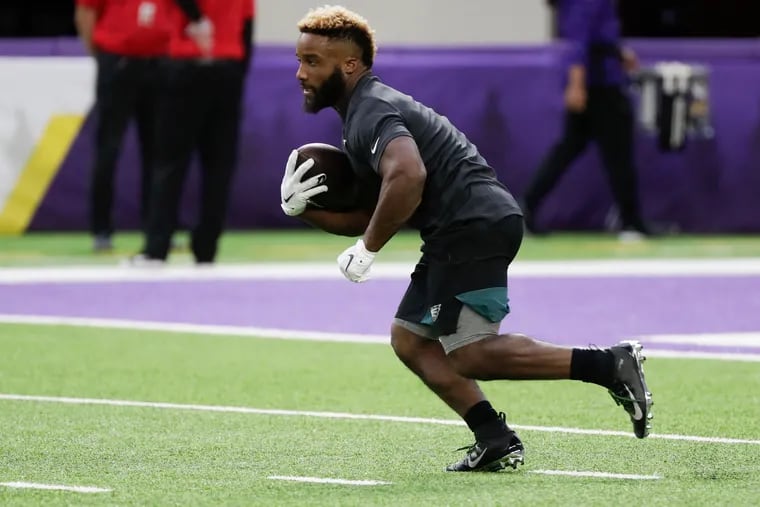 Eagles running back Boston Scott runs with the football during pregame warm-ups before the Eagles play the Minnesota Vikings on Sunday, October 13, 2019 in Minneapolis.