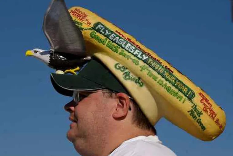 Mike Paquin of Landsdowne, wears a cheesesteak hat with a mechanical eagle that flaps.