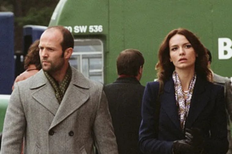 Jason Statham and Saffron Burrows as Terry and Martine in &quot;The Bank Job.&quot;