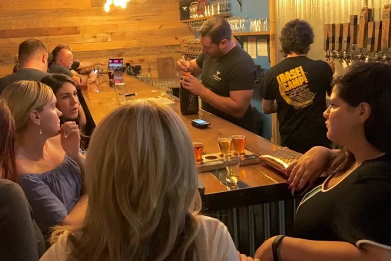 A lively Thursday night at Devil’s Creek Brewery in downtown Collingswood, where nearly 20 percent of the populaton — higher than the state average — is between 22 and 34.