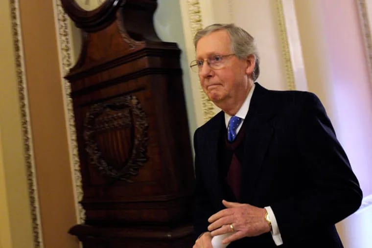 Senate Minority Leader Mitch McConnell of Ky. walked to the Senate floor on Capitol Hill in Washington, Thursday, Dec. 27, 2012. (AP Photo/Susan Walsh)