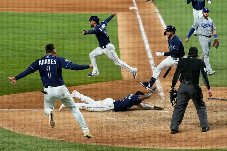 The Rays celebrate the winning run in the bottom of the ninth inning.