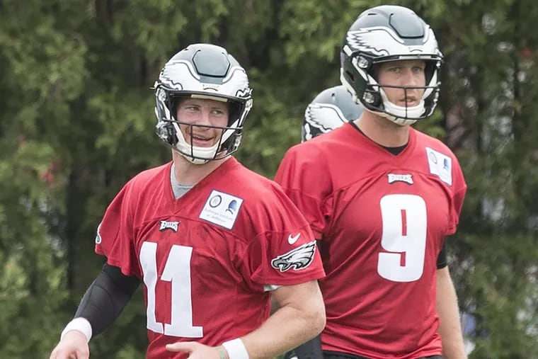 Carson Wentz (left) and Nick Foles at practice last week.