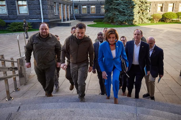 U.S. House Speaker Nancy Pelosi (front right) is escorted by Ukrainian President Volodymyr Zelensky (center) as she arrives with a congressional delegation at the Mariinsky Palace, May 1, 2022, in Kyiv, Ukraine.