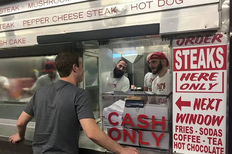 Mark Zuckerberg’s photo from his facebook page Sept 24, Sunday. “Traveled all the way to Philadelphia for the best cheesesteak in the land _ at The Original Pat’s King of Steaks.”