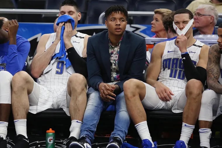 Markelle Fultz (middle), Nik Vucevic (9), and the Orlando Magic will face the 76ers in a preseason game on Oct. 13.