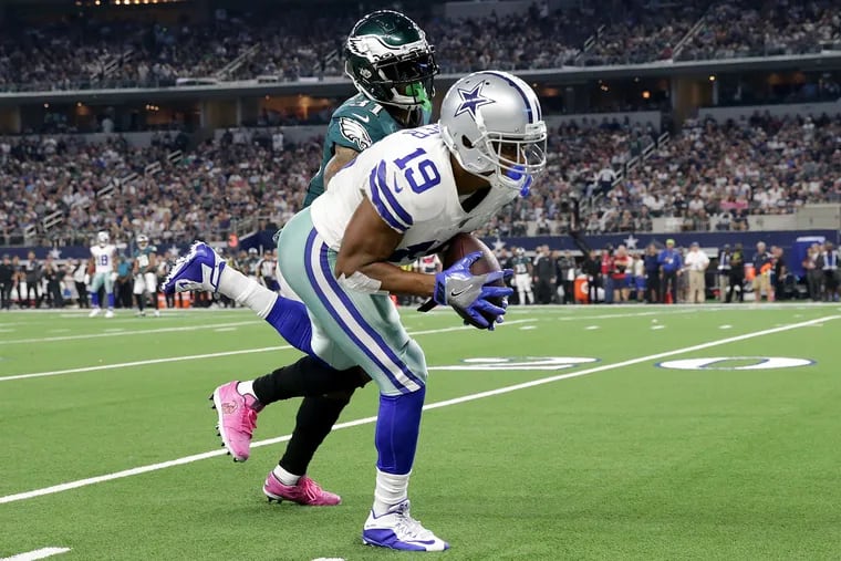 Dallas Cowboys wide receiver Amari Cooper, right, catches a pass in front of Eagles cornerback Jalen Mills, left, in the 4th quarter. Philadelphia Eagles fall 37-10 to the Dallas Cowboys at AT&T Stadium in Arlington, TX on October 20 2019.