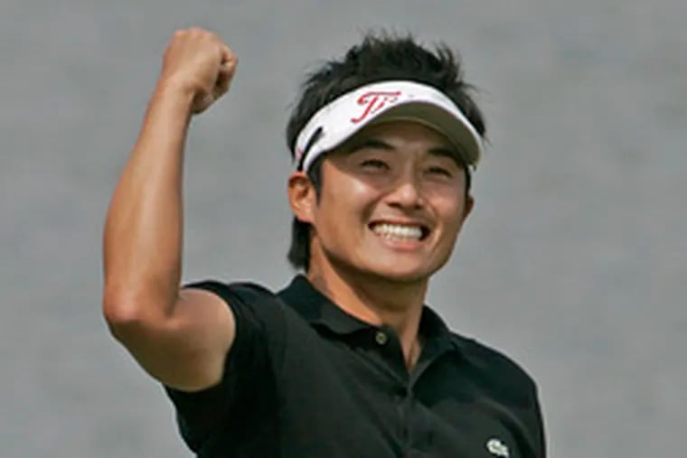 Ryuji Imada celebrates his first PGA Tour victory after sinking a putt on the playoff hole of the AT&T Classic in Duluth, Ga.