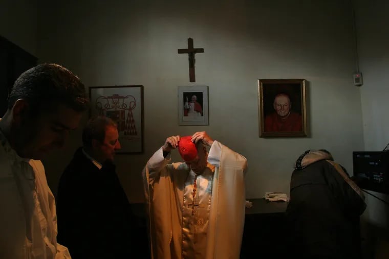 Cardinal Theodore McCarrick, now defrocked, prepares to celebrate Mass at the Basilica of Sts. Nereus and Achilleus in Rome in 2005.