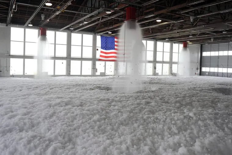 Firefighting foam fills a hangar at Mountain Home Air Force Base, Idaho. The Air Force says it will no longer use firefighting foam that contains PFOS.
