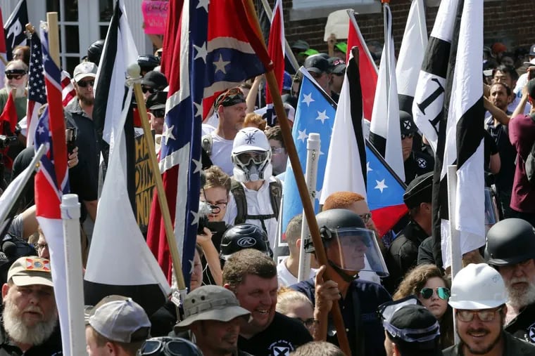 In August 2017, white nationalist demonstrators walked into the entrance of Lee Park surrounded by counter demonstrators in Charlottesville, Va. The rally erupted in violence, killing Heather Heyer. It was one of the most racist moments of the year, says columnist Solomon Jones.