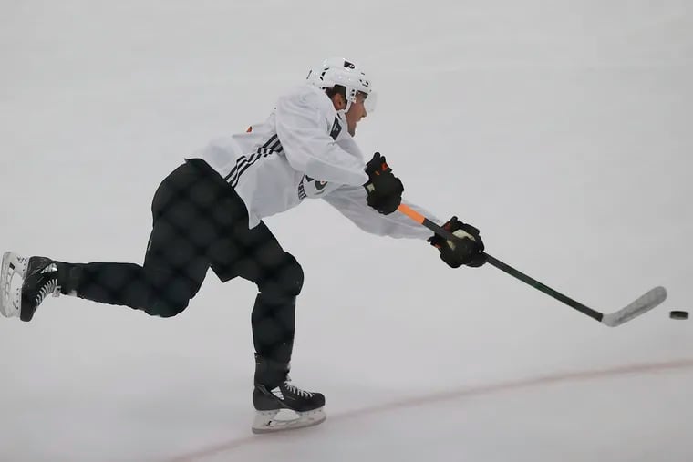 Flyers prospect Elliot Desnoyers shoots the puck during development-camp drills Sunday at the Skate Zone in Voorhees. The left winger made major strides on the junior level last season.