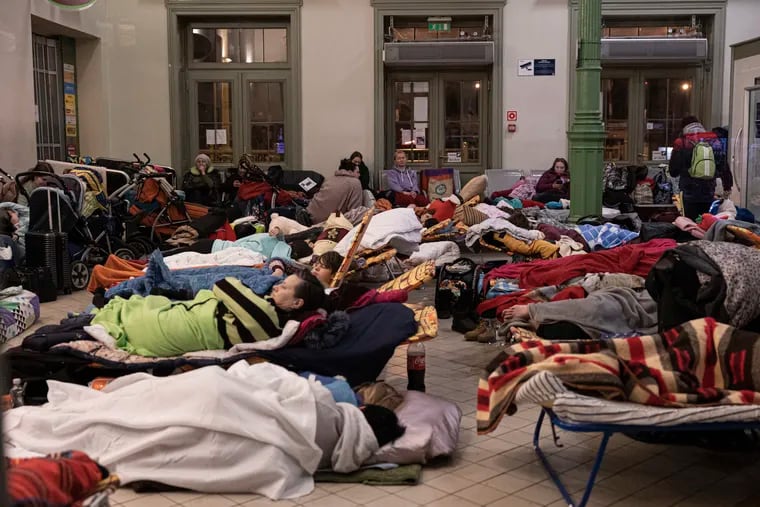 Refugees sleep at the train station in Przemysl, Poland on March 2, 2022. The number of Ukrainians forced from their country since the Russian invasion has been increasing daily.