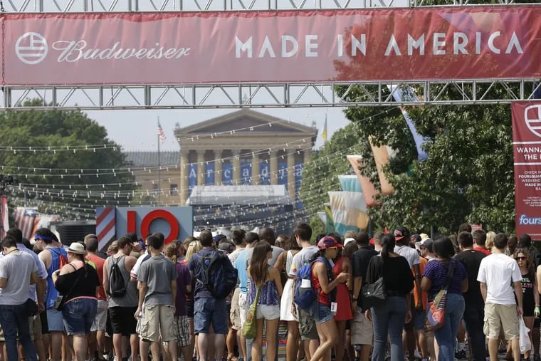 FILE – In this Sept. 1, 2012, file photo, people line up to enter the "Made in America" music festival, with the Philadelphia Museum of Art visible in the distance on the Benjamin Franklin Parkway in Philadelphia. Jay-Z, who founded the festival in 2012, is expressing disappointment after Philadelphia city officials confirmed Tuesday, July 17, 2018, that the annual Labor Day weekend music festival will no longer be held on the Benjamin Franklin Parkway in "the heart of the city" after the 2018 event, according to The Philadelphia Inquirer. (AP Photo/Matt Rourke, File)
