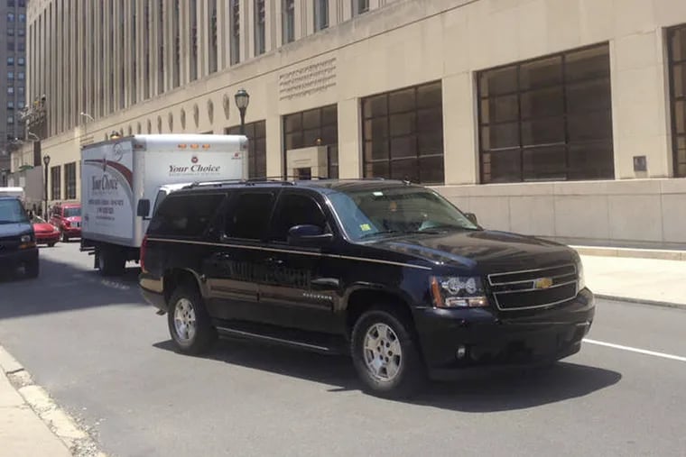 Omar Alameddin's Chevy Suburban, in which he takes calls for Uber as well as for Four Seasons Limousine Service.
