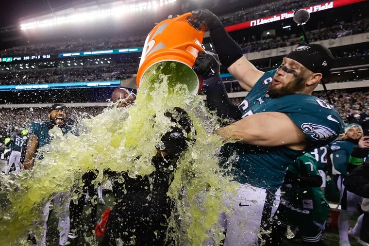 Eagles head coach Nick Sirianni gets the sports drink bath from offensive tackle Lane Johnson in the closing moments of the Birds' win against the San Francisco 49ers Sunday.