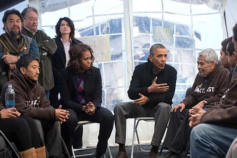 The president and Michelle Obama meeting with hunger strikers last month in a tent on the National Mall in Washington. As deportations continue, the president has seen his standing with Hispanics fall sharply. PABLO MARTINEZ MONSIVAIS / AP