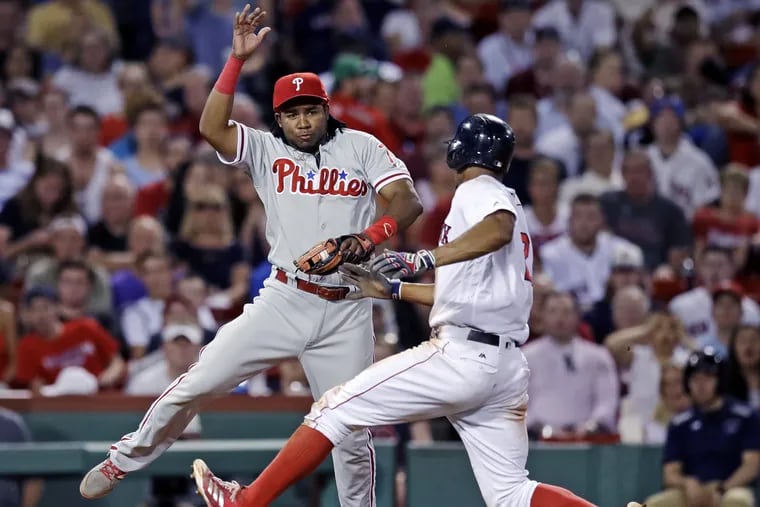 Phillies third baseman Maikel Franco, shown here making a tag on Xander Bogaerts last year, was 6 for 9 in the Phillies two games in Fenway Park last season.