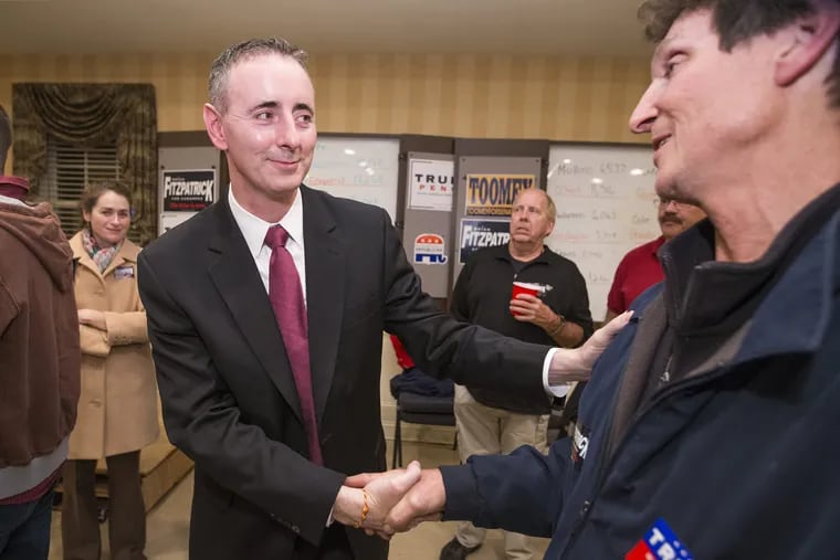 Brian Fitzpatrick (left) is congratulated at Republican headquarters in Doylestown on Election Night in 2016. 