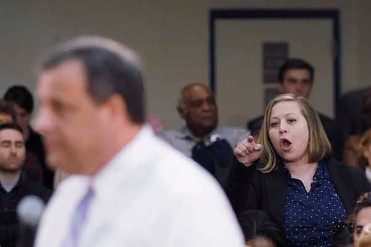 Kailee Whiting yells out to Governor Chris Christie at a town meeting in Mount Laurel on March 13, 2014. ( MICHAEL S. WIRTZ / Staff Photographer )