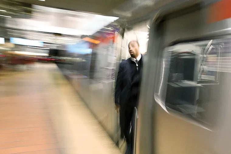 Silverliner V's at Market East Station around 4 pm today. SEPTA has become one of the top transit agencies in the country.  Wednesday, February 20, 2013. A conductor looks out of the Silverliner V as the train leaves the station. (  Steven M. Falk / Staff Photographer )