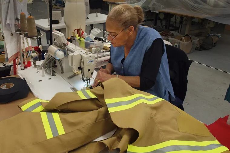 Argentina Feliciano is among nearly 40 sewing-machine operators at Ricochet Manufacturing Co., which expects to hire at least another 30 as a result of its new contracts to provide protective clothing to Air Force firefighters.