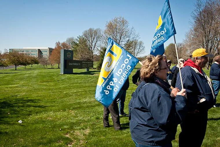 Members of United Steel Workers 6996 in Wyomissing, PA, protest outside Crown Holdings’ corporate headquarters in the Northeast on April 23, 2014. ( RON TARVER / Staff Photographer )