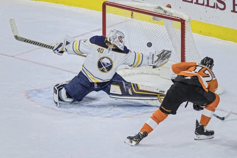 Buffalo Sabres goalie Robin Lehner, left, redirects Philadelphia Flyer Wayne Simmond’s shot on goal in the second period, causing it to sail wide of the net. Flyers win 4-1. Philadelphia Flyers versus the Buffalo Sabres at the Well Fargo Center on Sunday, January 7, 2018.