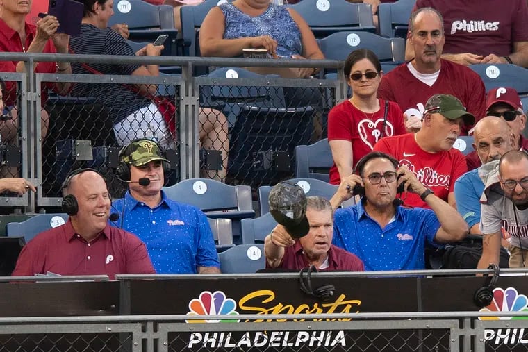 From Left, NBC Sports Philadelphia's announcers, Tom McCarthy, left,  Ben Davis, John Kruk and Ruben Amaro Jr., right, interact minutes before calling the game from left field on Tuesday, August 23, 2022.