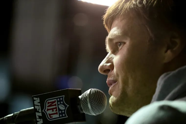 Patriots quarterback Tom Brady is interviewed by reporters on Tuesday.