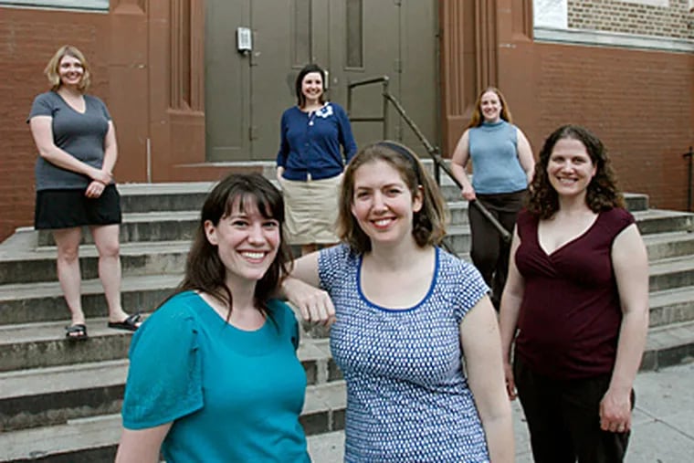 The transformative mothers outside Andrew Jackson Elementary School, which they intend to improve and rebuild in anticipation of sending their own children there. From left, they are Christina Grimes, Jackie Gusic, Katie Lavelle, Jennifer Zanck, Terry Jack, and Jennifer Singer. (Charles Fox / Staff)
