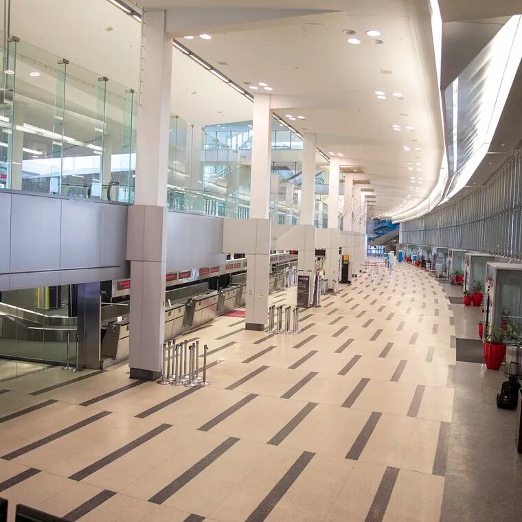 Philadelphia International Airport's Terminal A West is where a person with measles recently traveled through the federal inspection area, possibly exposing others. In this file photo from March 2020, it was empty due to travel bans at the start of the coronavirus shutdowns.