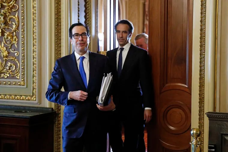 Treasury Secretary Steve Mnuchin steps out of a meeting on Capitol Hill in Washington, Tuesday, March 24, 2020, as the Senate works to pass a coronavirus relief bill.