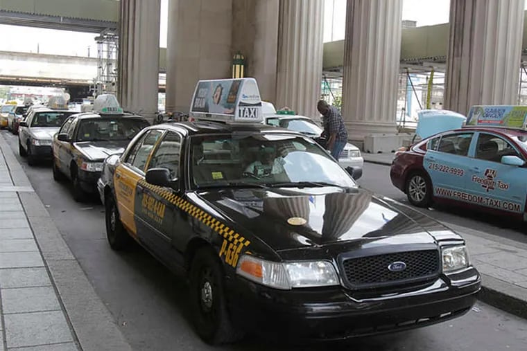 Taxis wait for customers at 30th Street Station. (Akira Suwa / Staff Photographer)