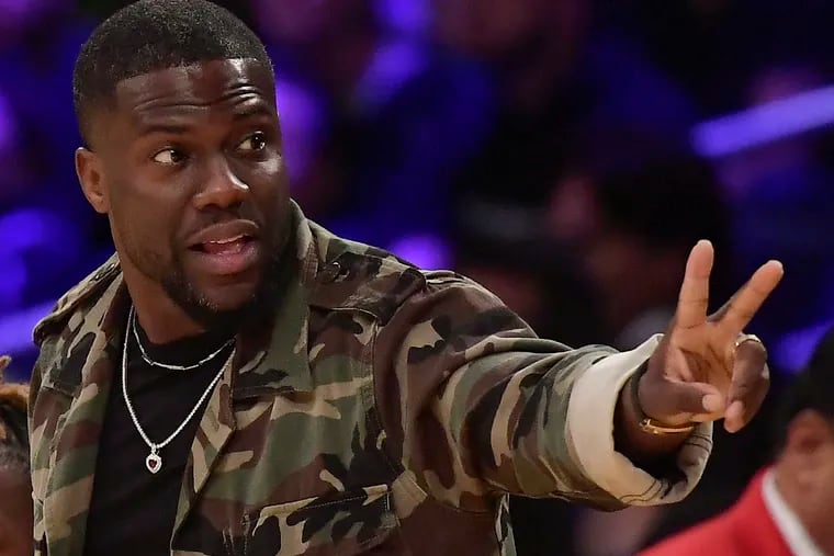Actor Kevin Hart gestures during the second half of an NBA basketball game between the Los Angeles Lakers and the Philadelphia 76ers in Los Angeles in 2019.