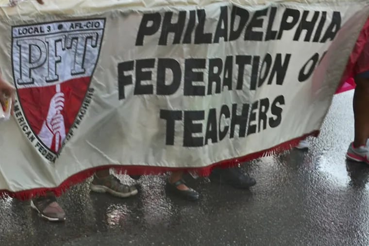 Members, family and friends of the Philadelphia Federation of Teachers march along Columbus Blvd. September 2, 2013, in the Philadelphia Council AFL-CIO's 26th annual Tri-State Labor Day Parade and Family Celebration. File. ( TOM GRALISH / Staff Photographer )
