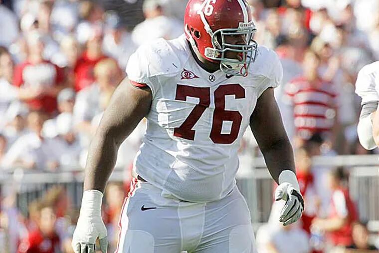 Alabama offensive tackle D.J. Fluker is at the Senior Bowl, and making history - since he recently graduated, he has been allowed to participate even though he was technically a junior last season. (Keith Srakocic/AP file photo)