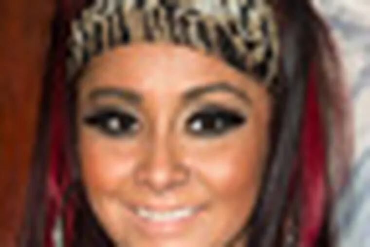 FILE - Nicole "Snooki" Polizzi attends a press event to announce her new venture, Team Snooki Boxing and the upcoming boxing matches featuring Ireland's Hyland brothers, in New York, in this Jan. 12, 2012 file photo. Snooki gave birth to her first child early Sunday morning Aug. 26, 2012 at Saint Barnabas Medical Center in Livingston N.J. according to MTV. A baby boy weighing 6lbs, 5oz. (AP Photo/Charles Sykes, File)