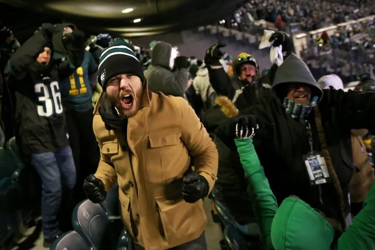 Eagles fans cheer during the second half of the Eagles’ win over the Falcons on Saturday.