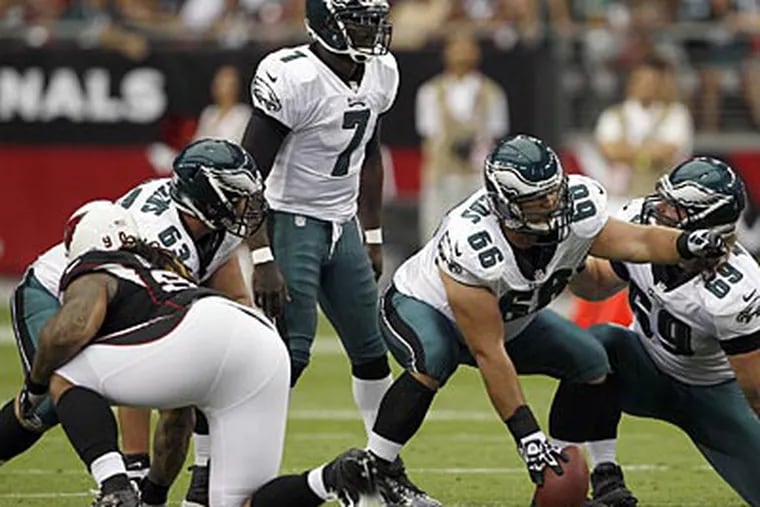 Eagles quarterback Michael Vick has been hit approximately 50 times in three games. (Yong Kim/Staff Photographer)