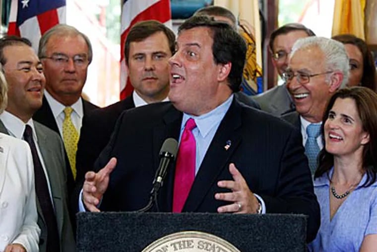 New Jersey Gov. Chris Christie reacts to a question after signing the state's budget into law on Tuesday. (AP Photo/Mel Evans)
